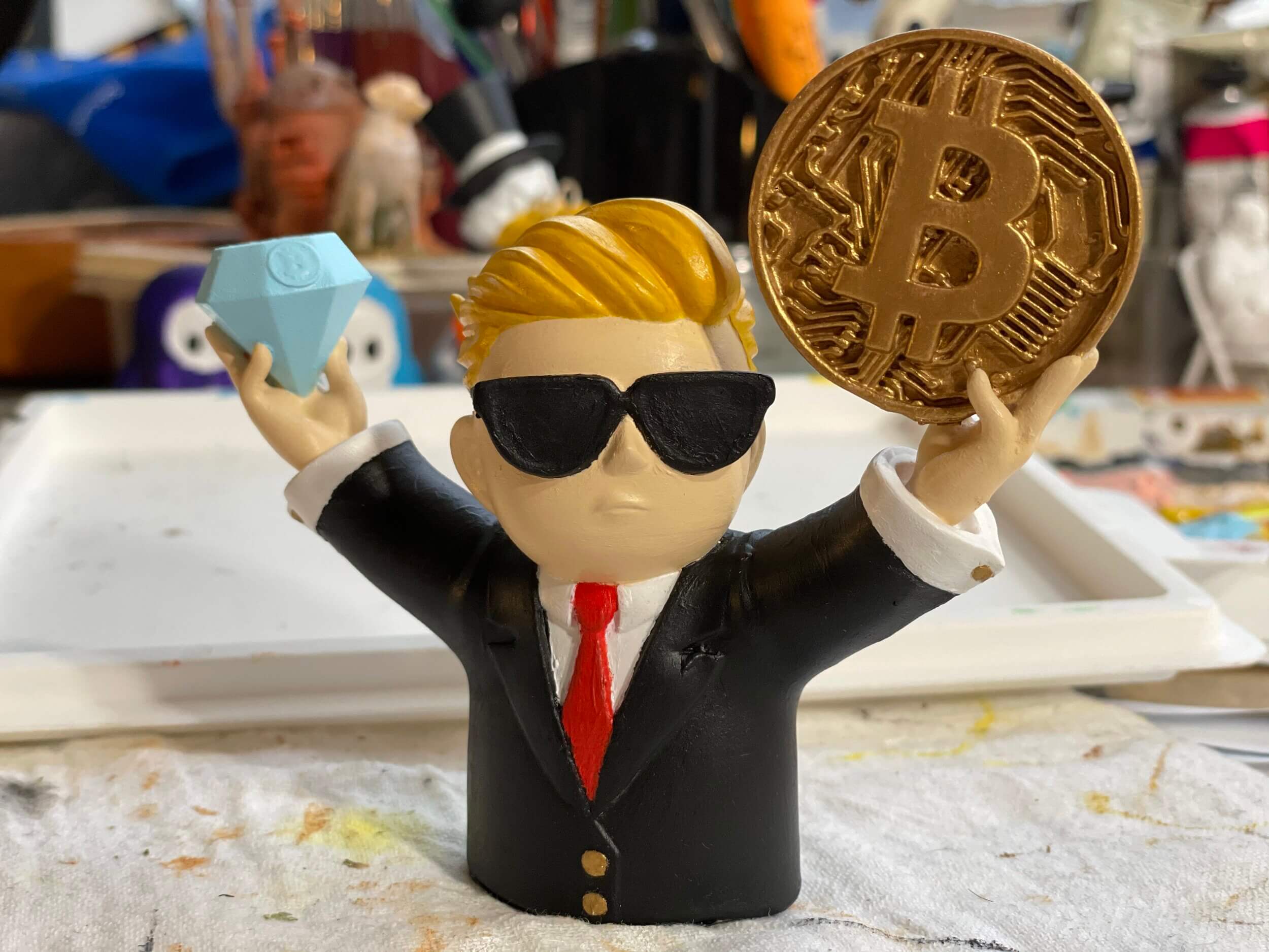 photo of 3d print of wall street bets character holding a bitcoin